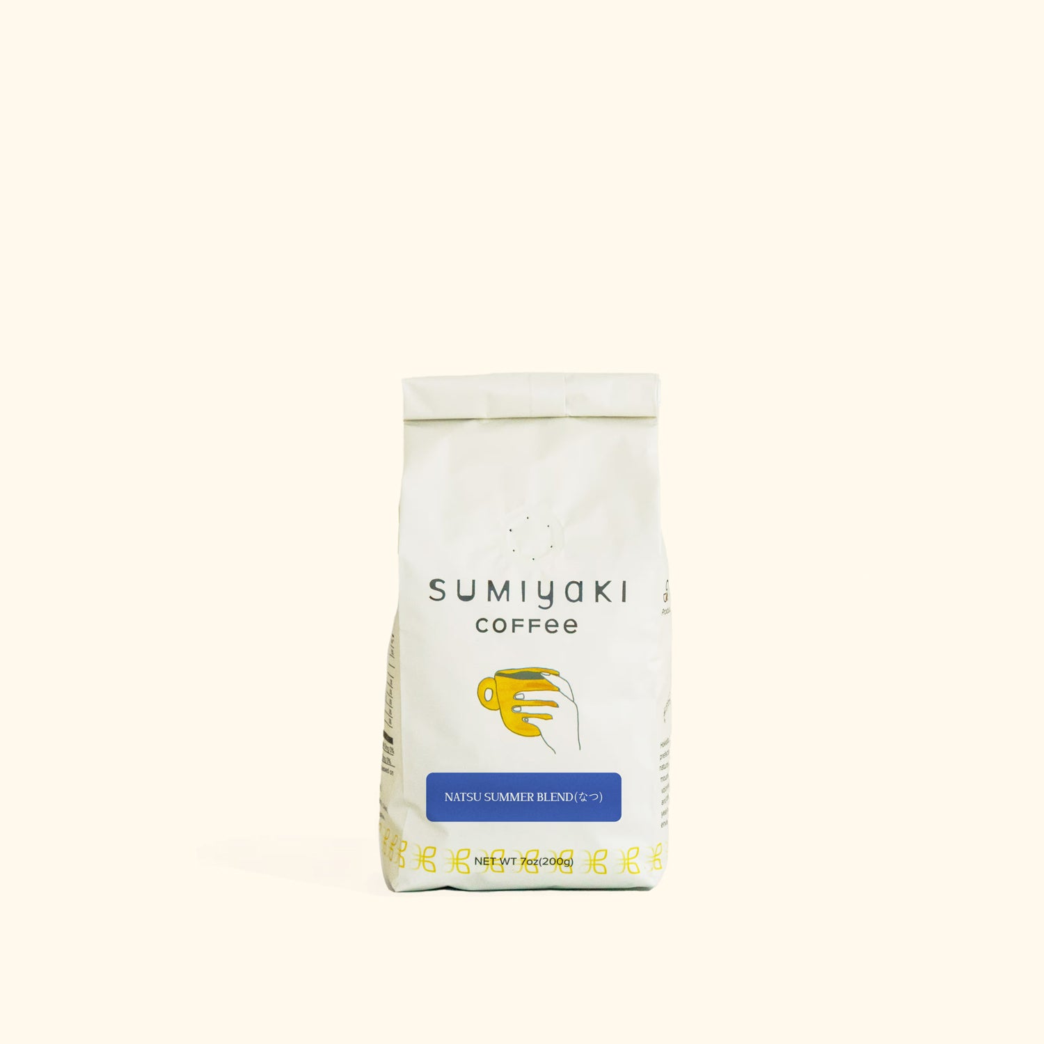 A white bag of Sumiyaki Coffee, Natural Summer Blend, centered on a solid cream-colored background.